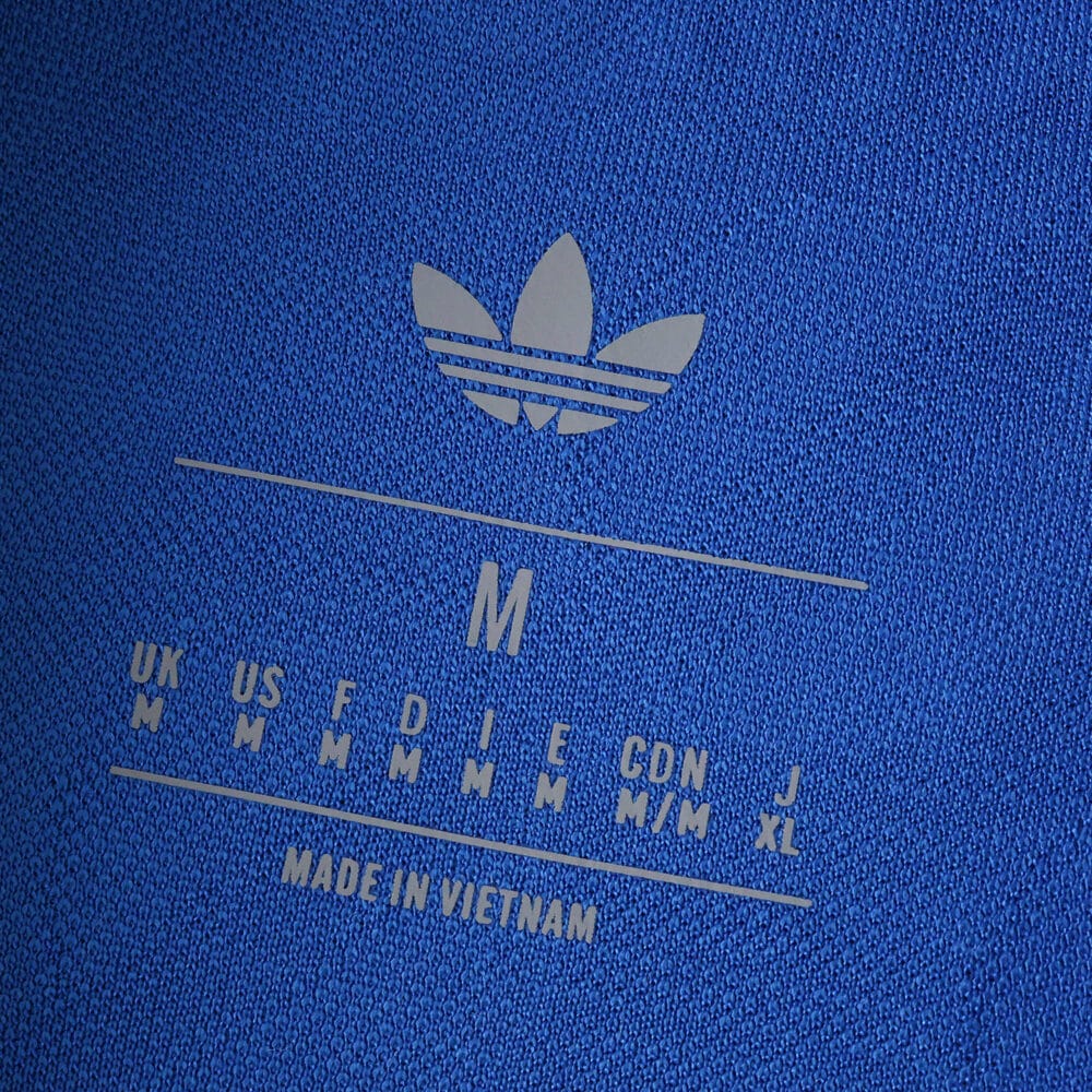 Close-up of the inside label on the Real Madrid 2025/26 Third Player Version shirt showing size and Adidas logo.