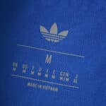 Close-up of the inside label on the Real Madrid 2025/26 Third Player Version shirt showing size and Adidas logo.
