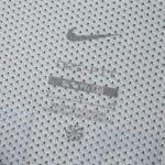 Close-up of Sporting CP Away 2025/26 Fan Version jersey fabric with Nike logo and Dri-FIT branding.