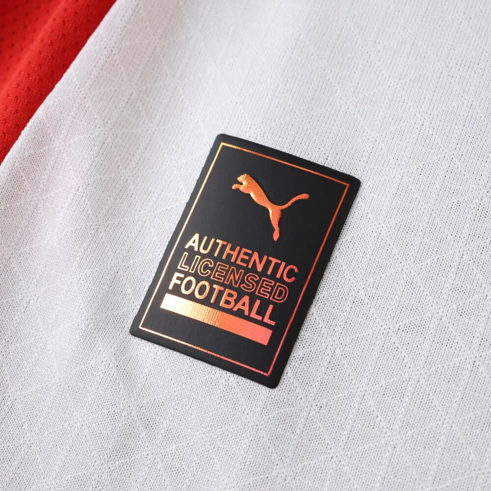 Close-up of the Puma Authentic Licensed Football badge on the AC Milan Away 2025/26 Player Version jersey.