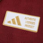 Close-up of the Aston Villa 2025/26 Home Player Version jersey's authentic licensed product label.