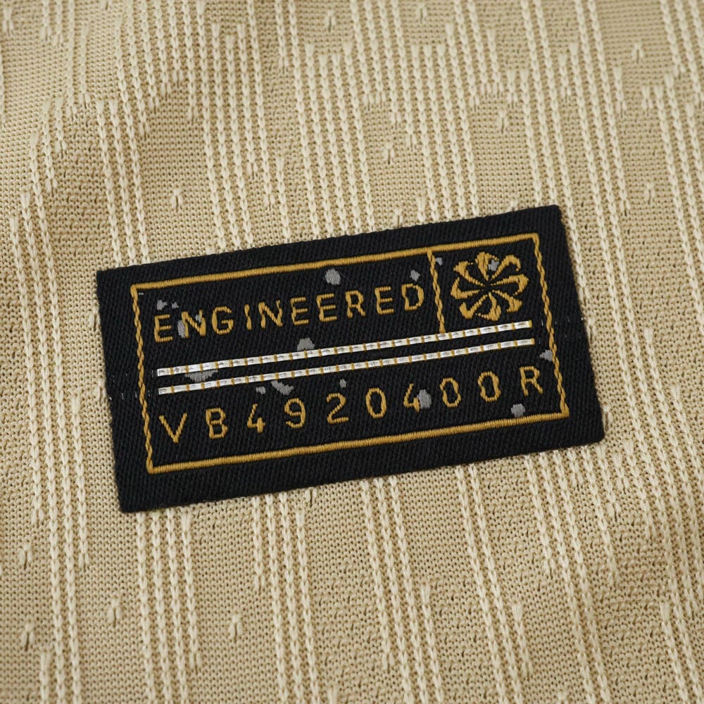 Close-up of the "Engineered" label on the 2025/26 Barcelona Away Player Version jersey.