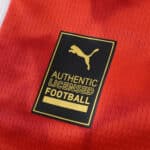 Close-up of the Puma Authentic Licensed Football badge on the Braga Home 2025/26 Fan Version jersey fabric.