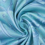 Close-up of Juventus Away 2025/26 Fan Version jersey fabric showing detailed blue swirling pattern.
