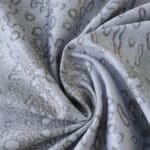 Close-up of the 2025/26 Manchester City Third Player Version jersey fabric with gray pattern detail.
