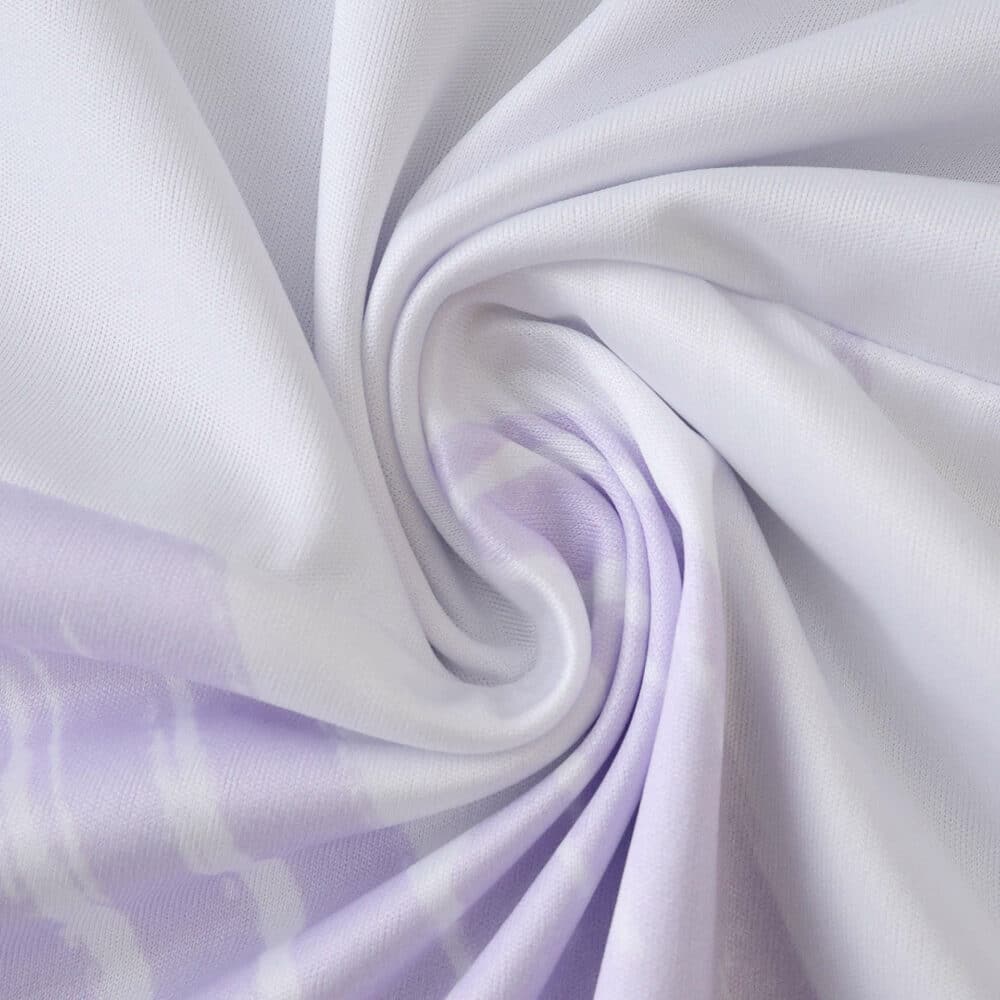 Close-up of the 2025/26 Manchester United away fan jersey fabric in light purple with subtle patterns.