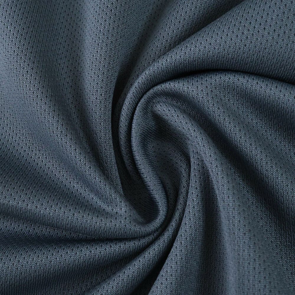 Close-up of dark blue fabric with a textured, breathable pattern for Rangers Third 2025/26 Fan Version jersey.