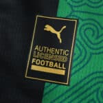 Close-up of the RC Lens Away 2025/26 Fan Version showing Puma authentic licensed football badge.