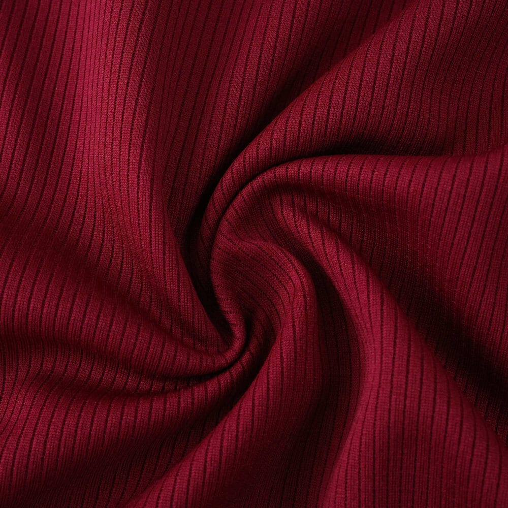 Close-up of the textured red fabric used in the Roma Home 2025/26 Fan Version jersey.