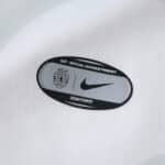 Close-up of the Sporting CP Away 2025/26 Fan jersey showing official license and Nike logo patch.