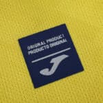 Joma original product label on the Villarreal 2025/26 home fan jersey yellow fabric.