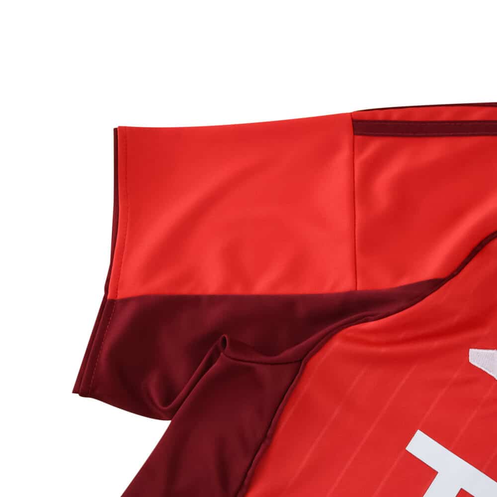Close-up of the 2025/26 Aberdeen Home Fan Version jersey showing red fabric and stitching details.