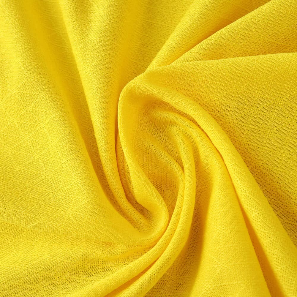 Close-up of yellow fabric used for the Borussia Dortmund 2025/26 Home Player Version jersey.