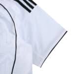 Close-up of the 2025/26 Fulham Home Fan Version jersey sleeve with black trim and subtle pattern detail.