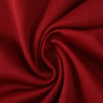 Close-up of red fabric used in Galatasaray Home 2025/26 Fan Version jersey, showing texture and weave.