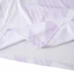 Close-up of the 2025/26 Manchester United away fan jersey fabric showing purple pattern details.