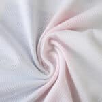 Close-up of Olympique Lyonnais 2025/26 Home Player Version jersey fabric texture in white.