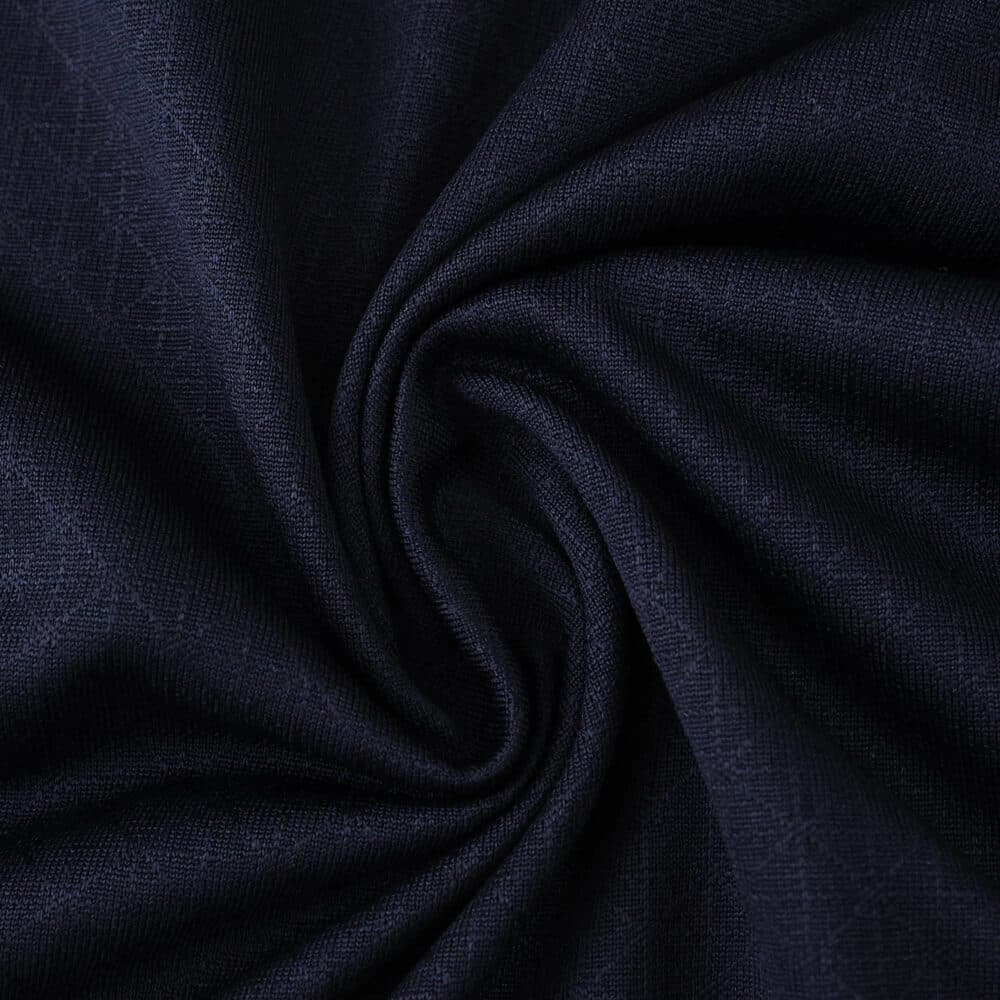 Close-up of navy blue fabric used for the Olympique Marseille Away 2025/26 Player Version jersey.