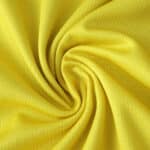 Close-up of yellow fabric texture for Parma Away 2025/26 Fan Version football jersey.