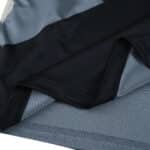 Close-up of Rangers Third 2025/26 Fan Version jersey fabric in black and silver colors.