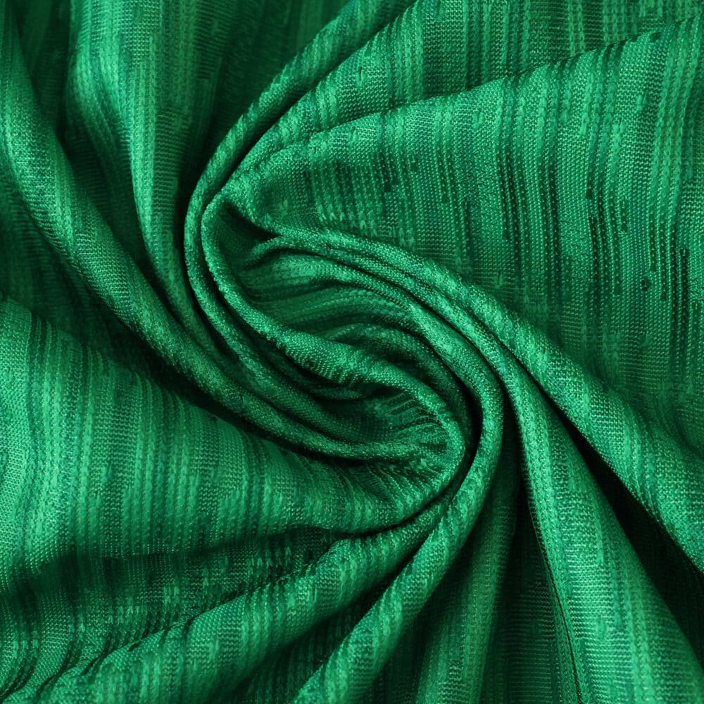 Close-up of green textured fabric used for the Real Betis Home 2025/26 Player Version jersey.