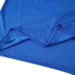 Close-up of Real Madrid Third 2025/26 Fan Version jersey fabric in blue, showing stitching detail.