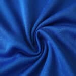 Close-up of blue Real Madrid Third 2025/26 Player Version jersey fabric, showing texture and detail.