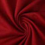 Close-up of red Roma Home 2025/26 Player Version jersey fabric showing texture and quality.