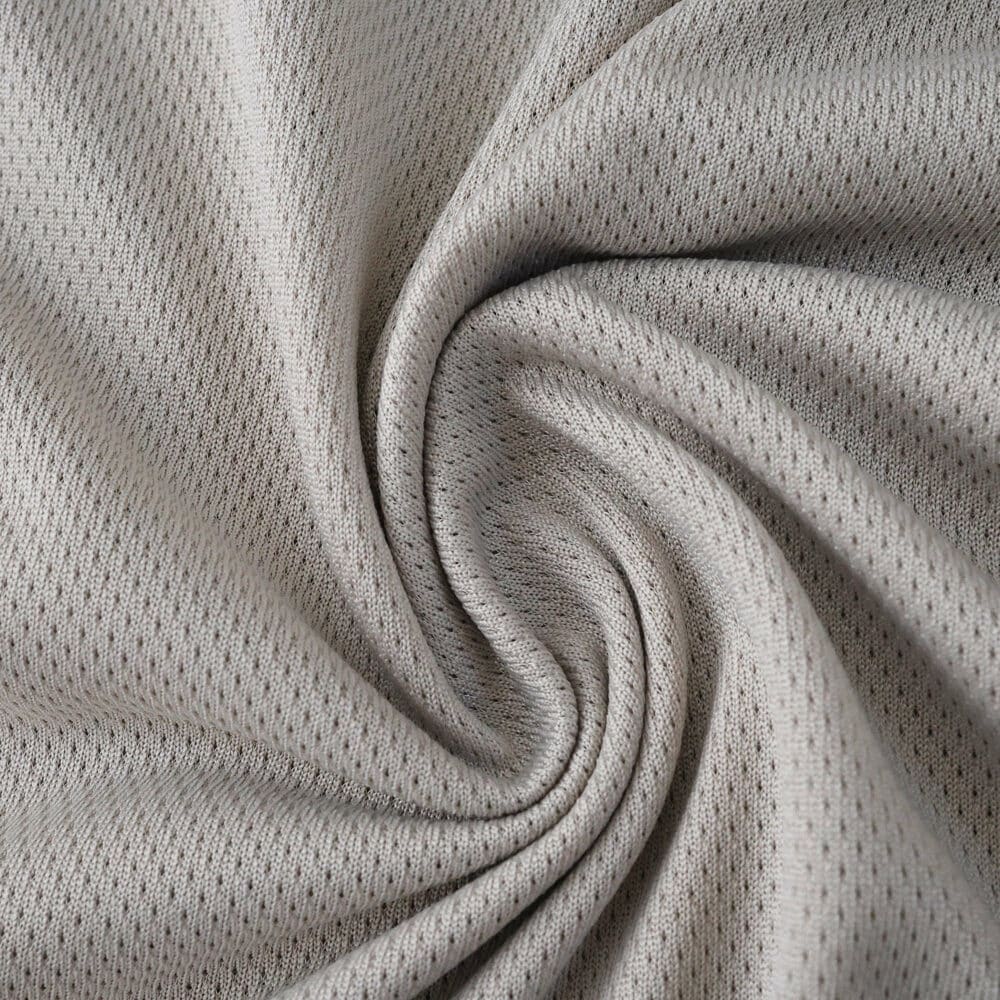 Close-up of SL Benfica Away 2025/26 Player Version jersey fabric in light grey, showing texture and weave.