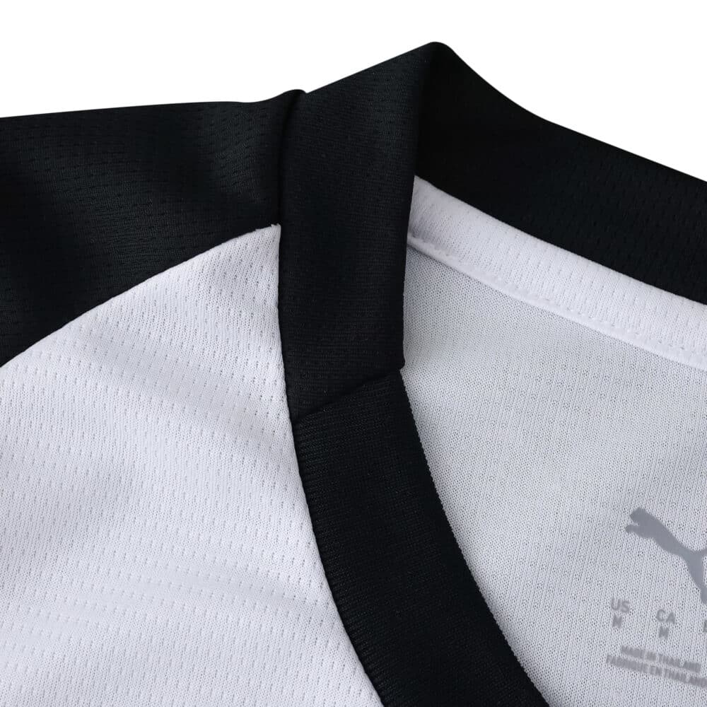Close-up of AC Milan Away 2025/26 Fan Version jersey collar in white with black trim.
