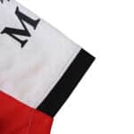 Close-up of AC Milan Away 2025/26 Player Version jersey sleeve showing white, red, and black color detail.