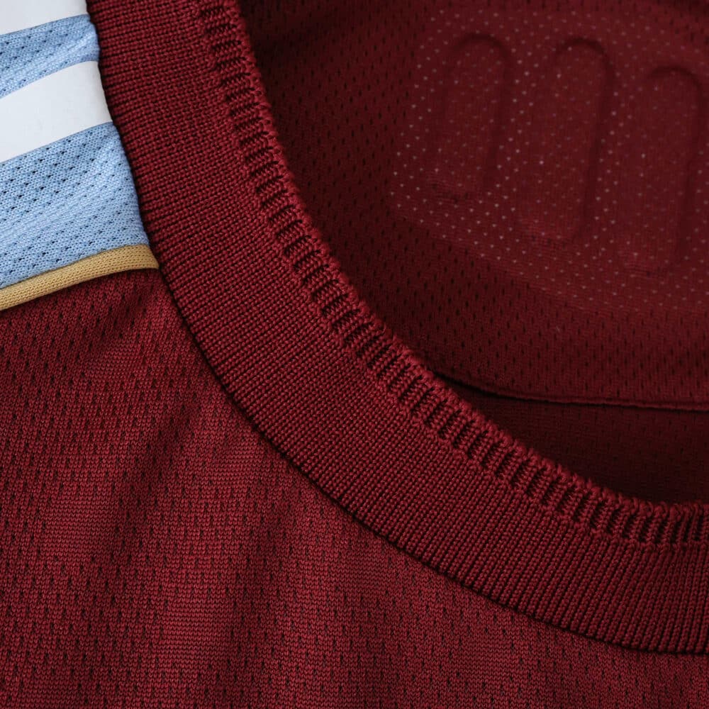 Close-up of the collar on the Aston Villa Home 2025/26 Player Version jersey, showing fabric texture and details.