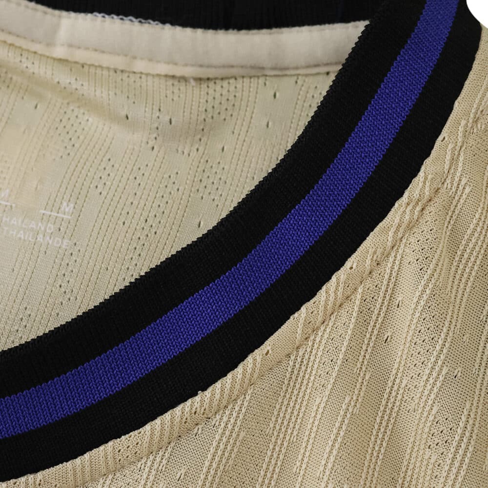 Close-up of the Barcelona 2025/26 Away Player Version jersey collar with black and blue stripe detail.