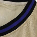 Close-up of the Barcelona 2025/26 Away Player Version jersey collar with black and blue stripe detail.