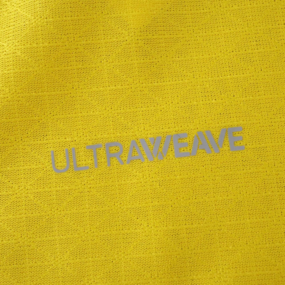 Close-up of yellow Borussia Dortmund 2025/26 Home Player Version jersey fabric with "ULTRAWEAVE" text.
