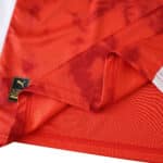 Close-up of Braga Home 2025/26 Fan Version jersey fabric with Puma authenticity tag visible.