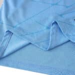 Close-up of the fabric and stitching detail on the Feyenoord Away 2025/26 Fan Version jersey in light blue.