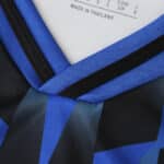 Close-up of the Hamburger SV 2025/26 home fan jersey collar with blue and black design details.