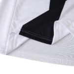 Close-up of the Parma Home 2025/26 Fan Version jersey fabric showing stitching and black design detail.