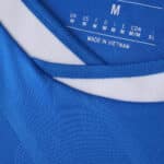 Close-up of the collar on the Real Madrid Third 2025/26 Fan Version jersey in blue with a white stripe.