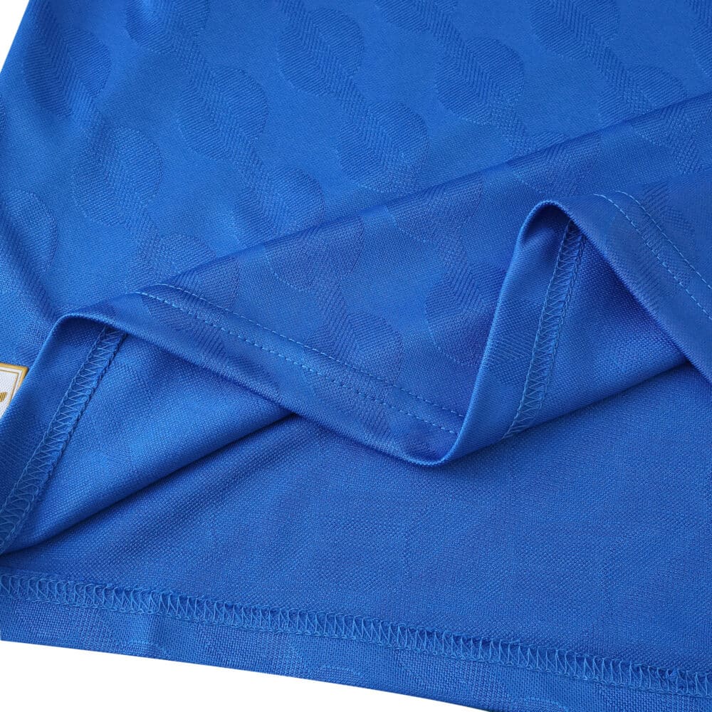 Close-up of blue Real Madrid Third 2025/26 Player Version jersey fabric and stitching details.