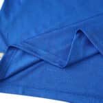 Close-up of blue Real Madrid Third 2025/26 Player Version jersey fabric and stitching details.