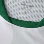 Close-up of the Sporting CP 2025/26 Away Fan Version jersey collar with green inner lining.