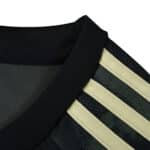 Close-up of Union Berlin Away 2025/26 Fan Version jersey collar with black and beige stripe detail.