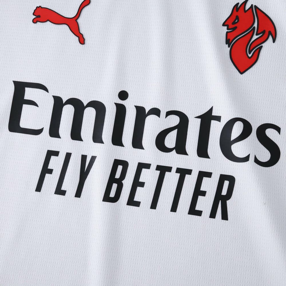 Close-up of AC Milan 2025/26 Away Fan Jersey showing sponsor, Puma logo, and club badge on white fabric.