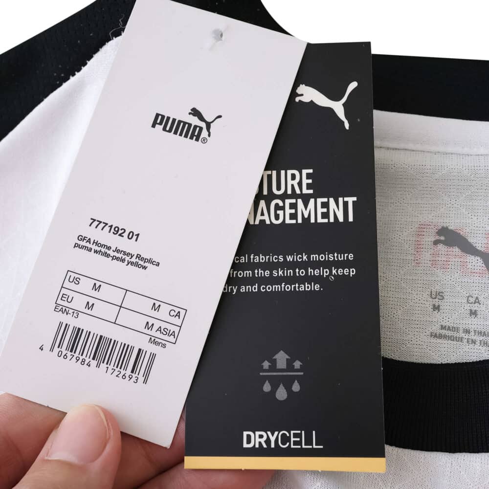 Close-up of AC Milan 2025/26 Away Player Version jersey tags showing Puma branding and Drycell technology.