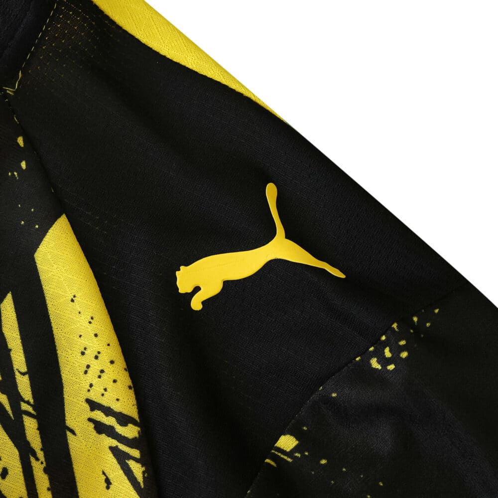 Close-up of Borussia Dortmund 2025/26 Home Player Version jersey featuring yellow Puma logo on the shoulder.