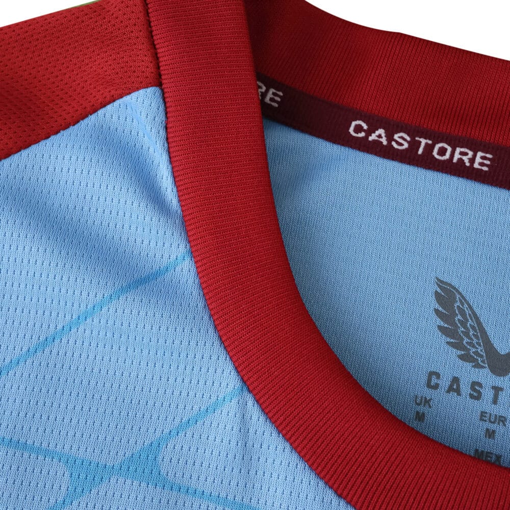 Close-up of Feyenoord 2025/26 Away Fan Jersey collar with red trim and Castore branding.