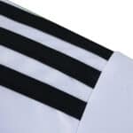 Close-up of Fulham Home 2025/26 Fan Version jersey sleeve with black stripes on white fabric.