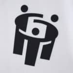 Close-up of the Hamburger SV 2025/26 home fan jersey featuring a black stylized graphic design on white fabric.